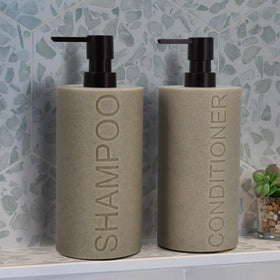 Indecor Home dispenser close-up showing embossed CONDITIONER text, premium feel.