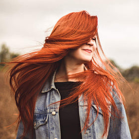 INDIAN NATURAL HAIR CARE henna powder red hair dye application on hand shows even paste