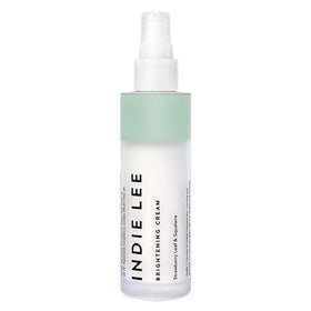 Indie Lee Brightening Cream jar close-up showing rich texture for radiant skin.