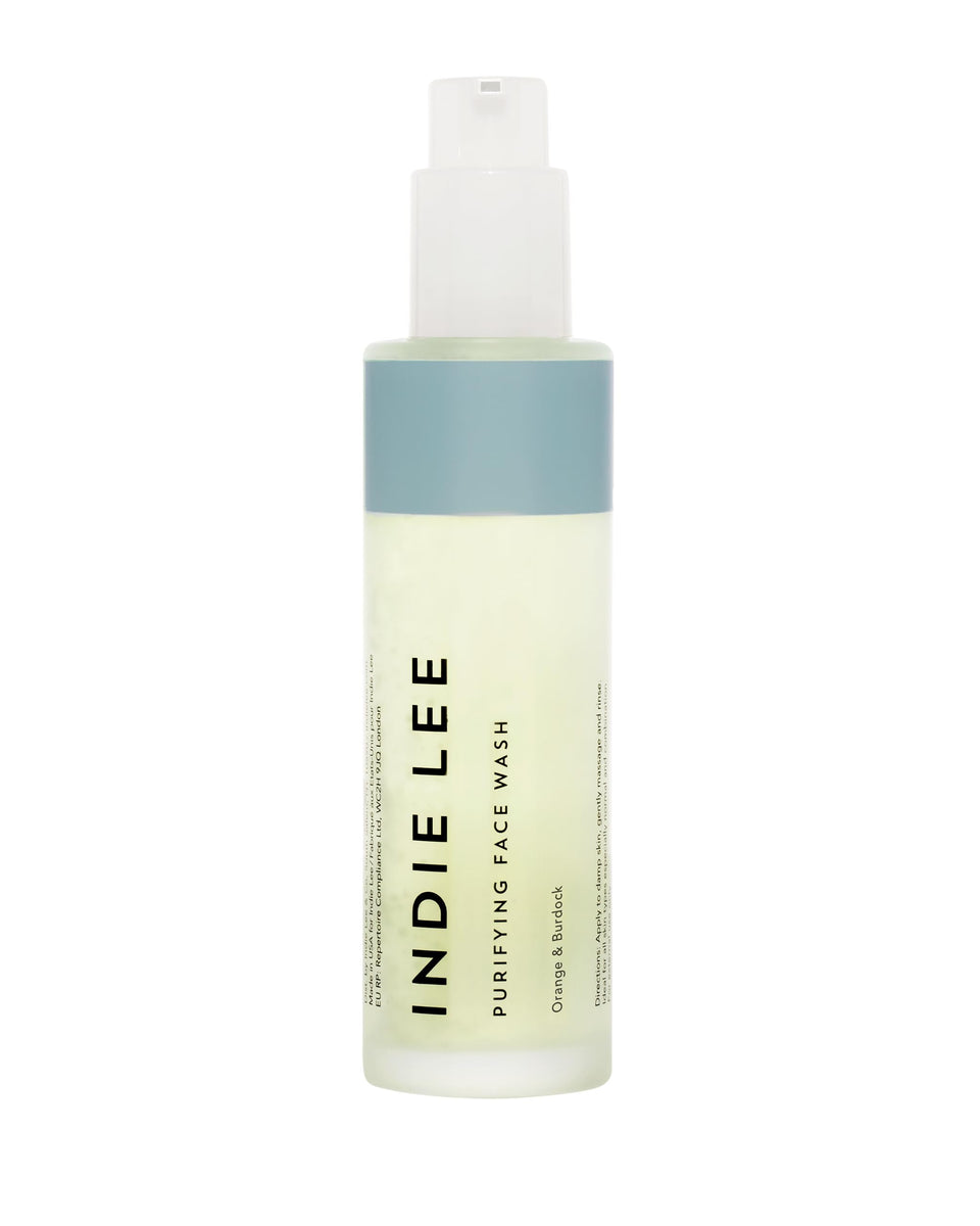 Indie Lee Purifying Face Wash bottle pour for daily cleansing and makeup removal.