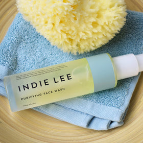 Indie Lee Purifying Face Wash with orange extracts for a refreshing cleanse.