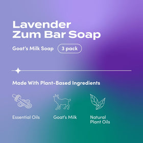 Indigo Wild Zum Lavender goat milk soap bar in hand shows creamy lather.