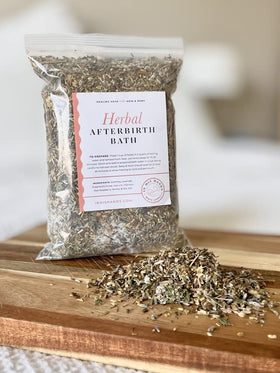 In His Hands Herbal Postpartum Bath brewed water shows a deep amber color for a calming soak.