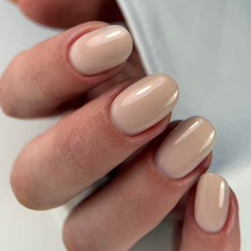 Thin, durable formula demonstrated for natural nail strengthening and overlays with a natural finish