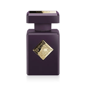 Initio Parfums Privés Side Effect bottle pouring, hints of tobacco and spice for evening allure.
