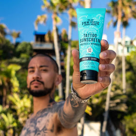 INK-EEZE application close-up demonstrates a clear, non-greasy rub on skin.