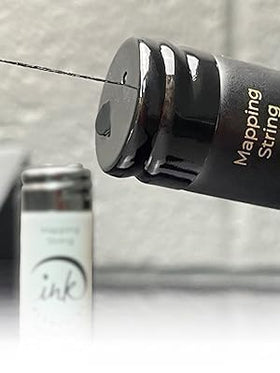 Ink Permanent brow mapping string in use during microblading ensures clean, consistent reference lines.