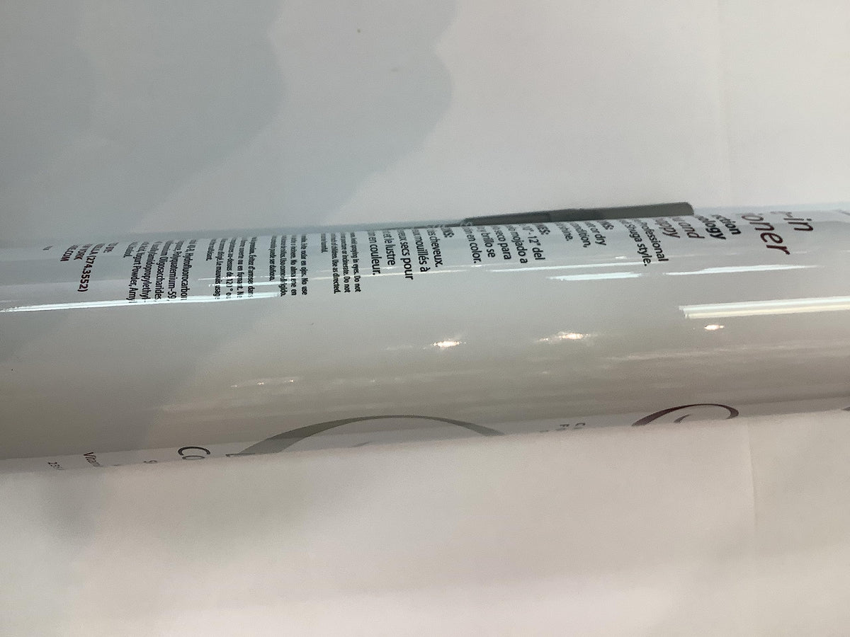 Packaging of Inkursive Shuga Spray Leave-In on a bathroom counter.