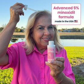 Innerbloom dropper applying minoxidil for women.