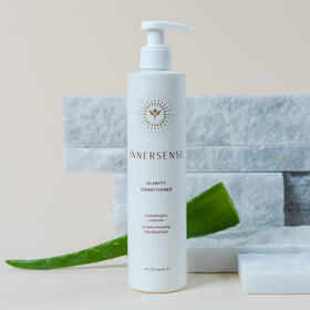 INNERSENSE Natural Clarity conditioner being applied to hair for lightweight moisture