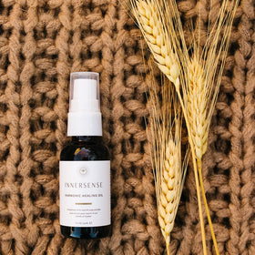 Applying INNERSENSE Natural Harmonic Treatment Oil to hair for shine