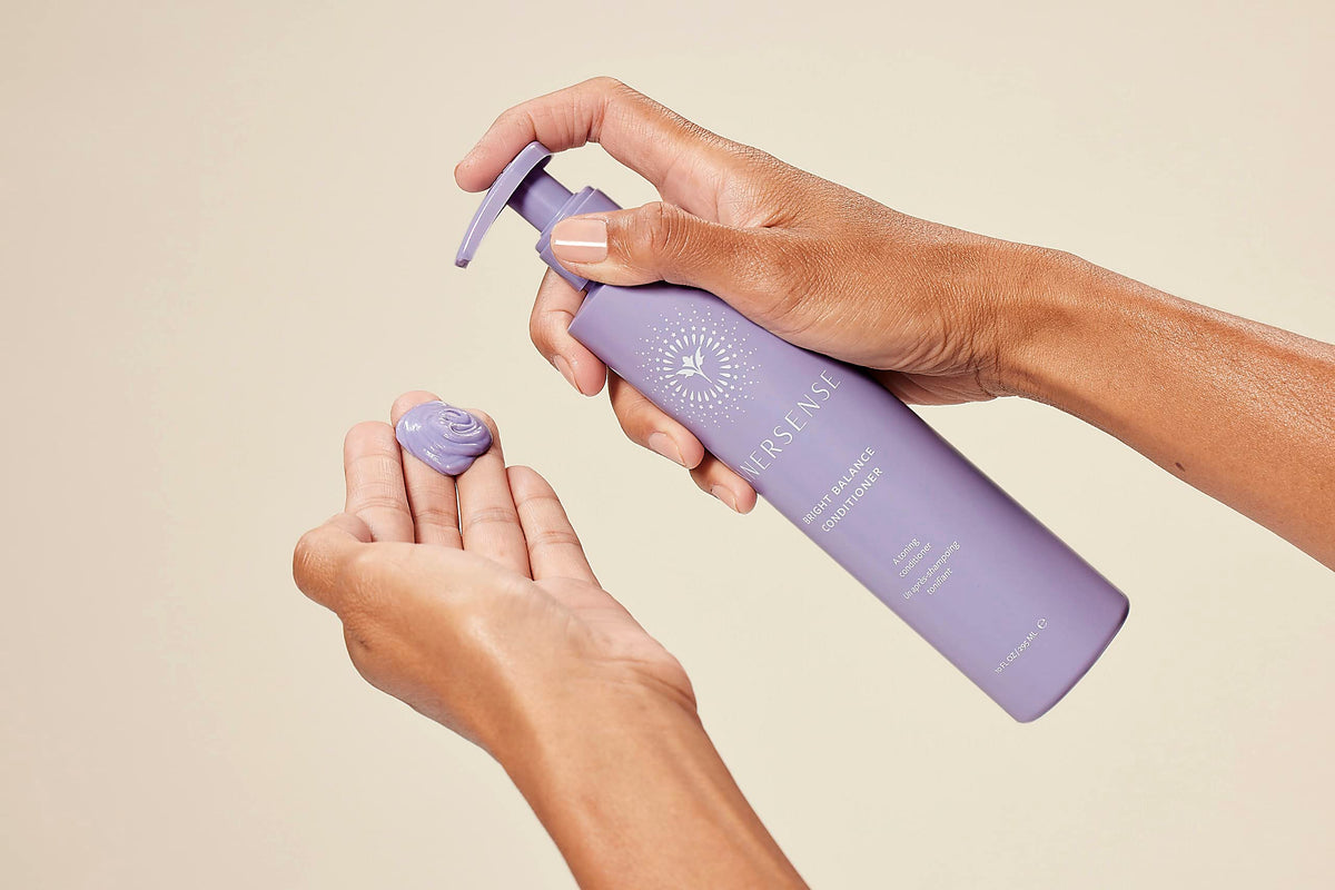 INNERSENSE Purple-toned duo on bathroom shelf suggesting a salon-inspired routine.