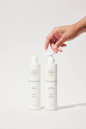INNERSENSE conditioner bottle close-up highlighting deep moisturizing for soft hair.