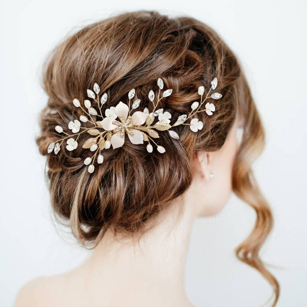 inSowni gold U-shaped flower pins secure delicate styles with rhinestones.