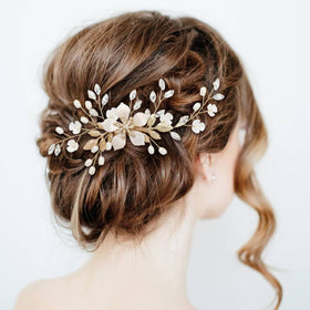 inSowni gold U-shaped flower pins secure delicate styles with rhinestones.