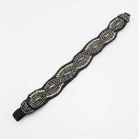 INSPIRELLE beaded headband keeps hair in place during active days.