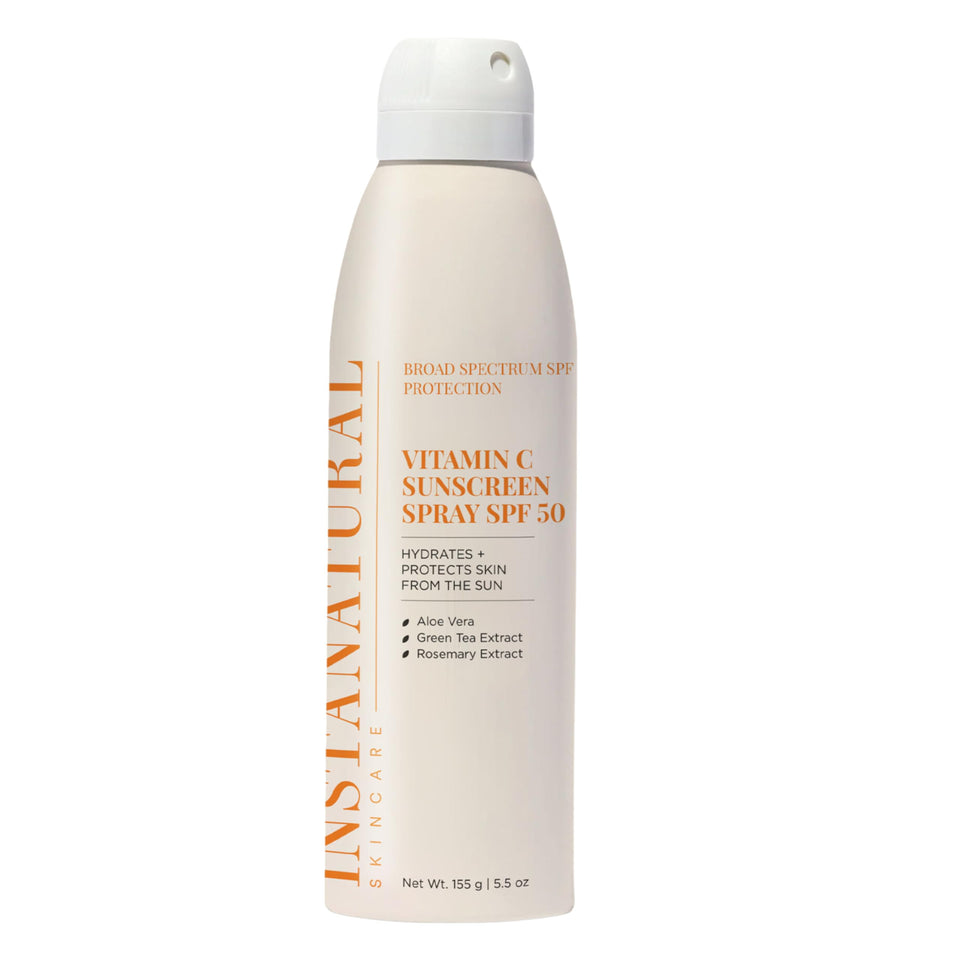 InstaNatural vitamin C SPF50 spray bottle ready for full-body sun protection.