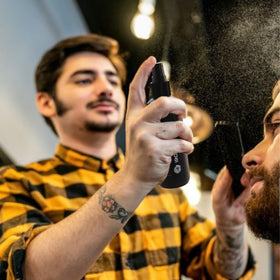 Fuller-looking hair with fibers secured by IRONMANE Hold Spray.