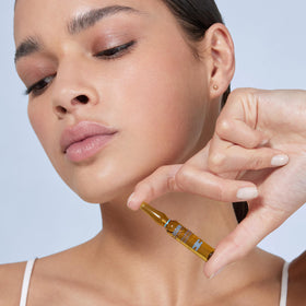 ISDIN Isdinceutics booster ampoules in use for refreshed, non-greasy finish on skin