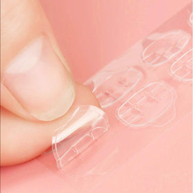 Ivtor applying tabs on nails, demonstrating easy press-and-set method