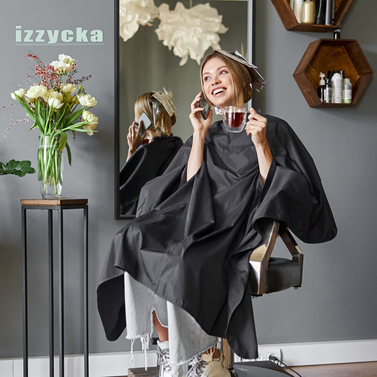 Izzycka barber cape supports various tasks like dye, cut, and makeup touches.