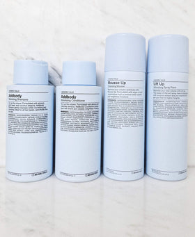 J Beverly Hills Addbody 12oz packaging displayed for at home volumizing routine.