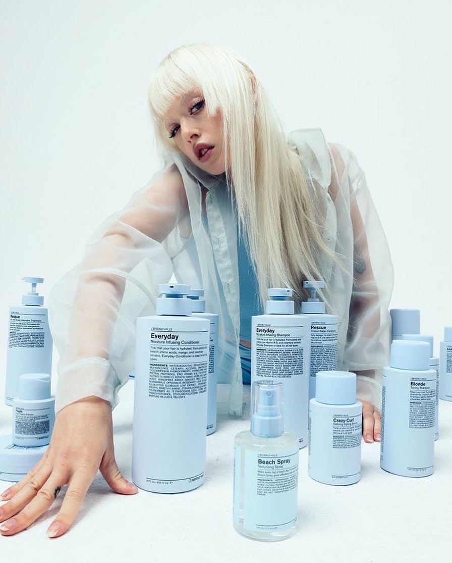 J Beverly Hills Blue Everyday Shampoo on shelf highlighting eucalyptus-infused formula for a refreshing cleanse.