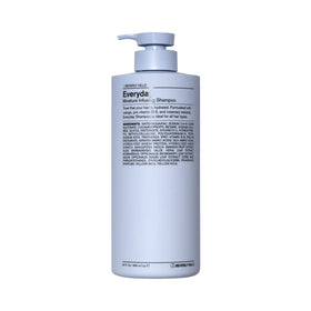 J Beverly Hills Blue Everyday Shampoo bottle pouring to cleanse buildup and refresh the scalp.
