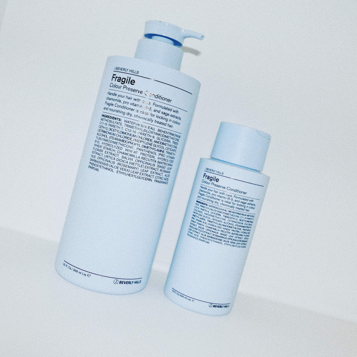 J Beverly Hills Blue Fragile conditioner bottle cap highlighting secure handling