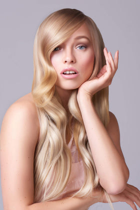 Brand logo on the bottle signals professional-quality hair care.