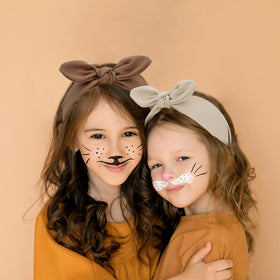 Jaciya knotted bow headband khaki provides casual chic look and reliable hold