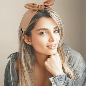 Jaciya knotted bow headband white adds fresh, clean accessory for any outfit