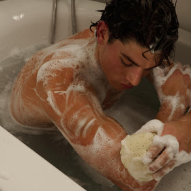 Jack Henry body wash men bathroom scene conveys quick residue-free rinse experience