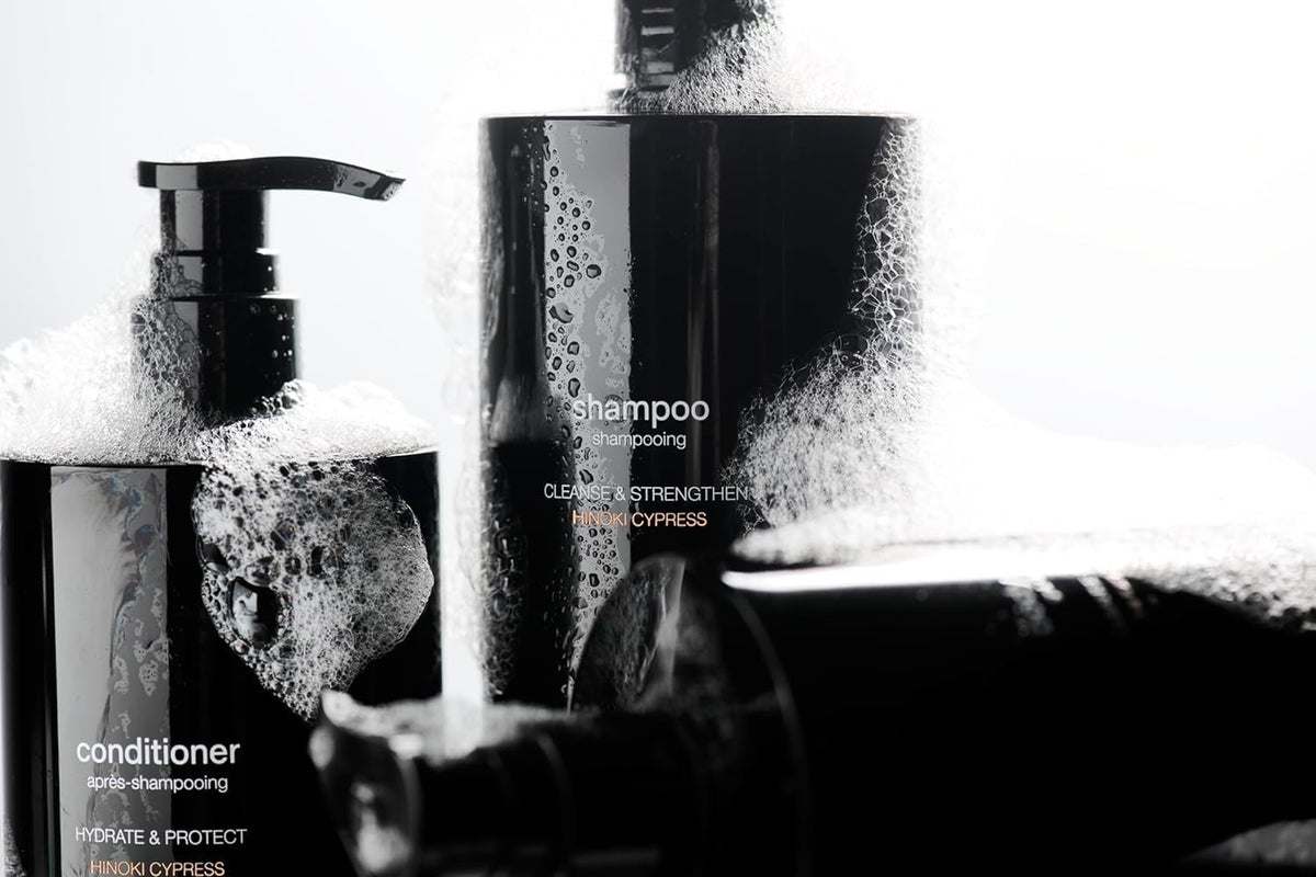 Jack Henry Creamy Shampoo creating rich lather on hands for cleansing.