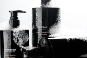 Jack Henry Creamy Shampoo creating rich lather on hands for cleansing.
