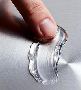 Jack Henry Hair Wax wet-look back shot emphasizes polished, fluid style.