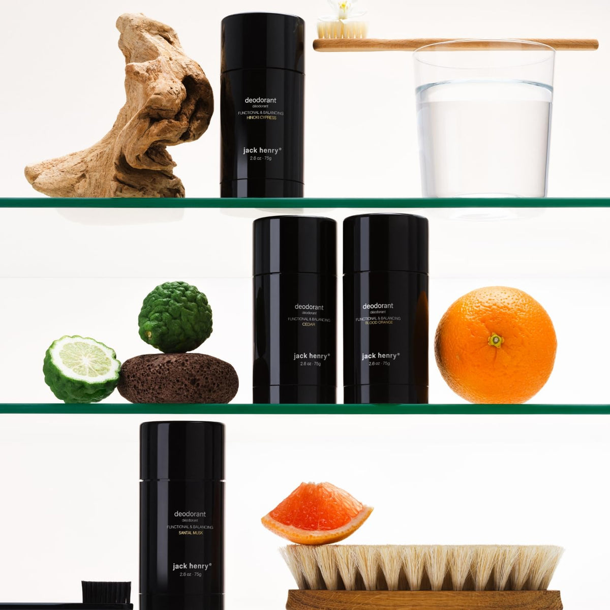 Sustainable packaging materials with recycling symbol beside deodorant.