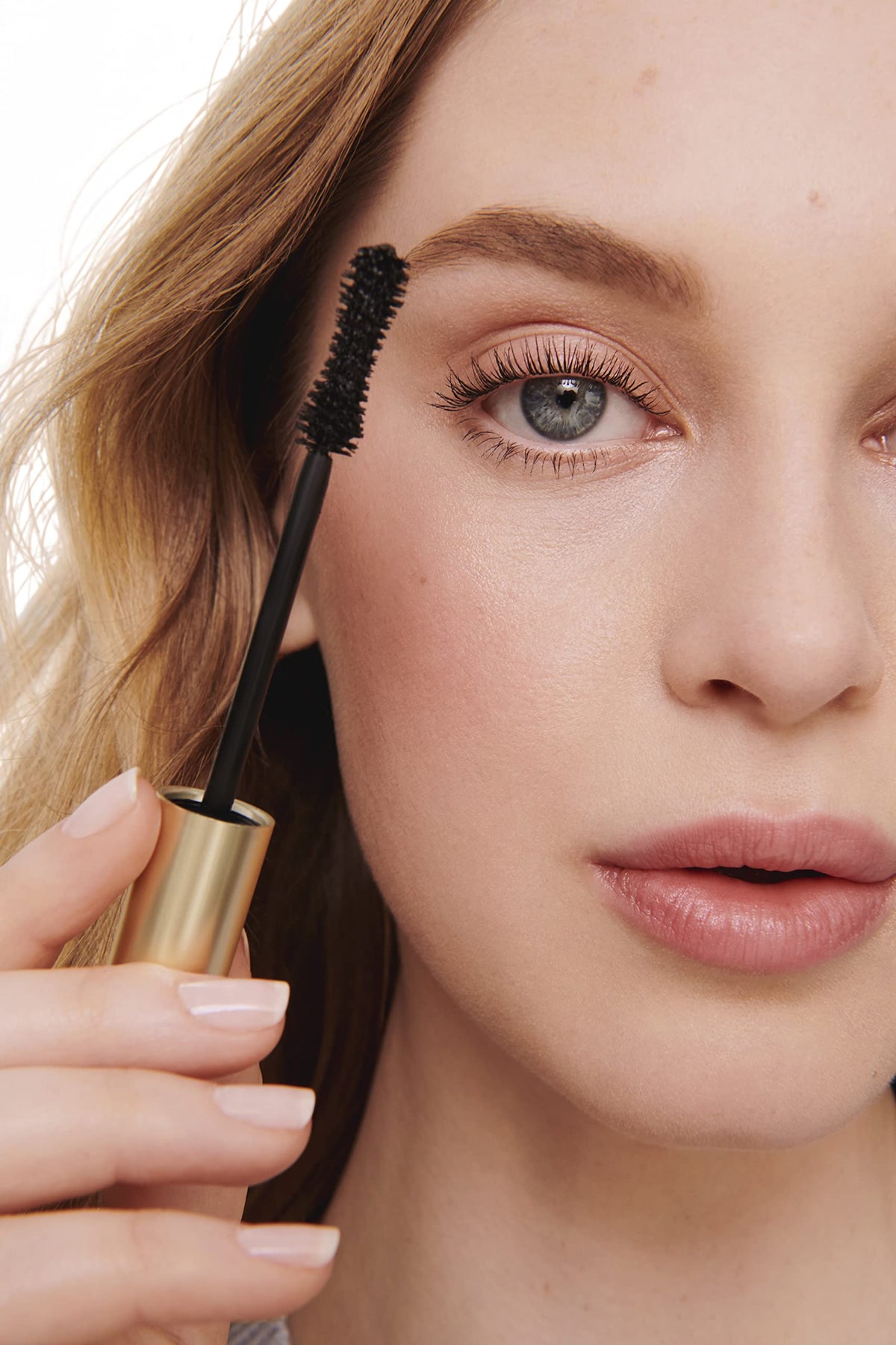 Jane Iredale Beyond Lash Mascara on inner and outer corners offers lift.
