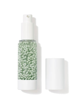 Jane Iredale HydroPure Serum bottle with green tint for redness neutralization and hydration.