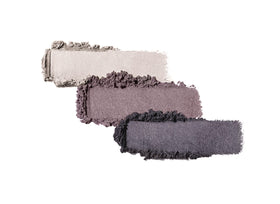 Swatches of Jane Iredale PurePressed Eye Shadow Triple Sundown showing sunset-inspired hues for eye dimension.