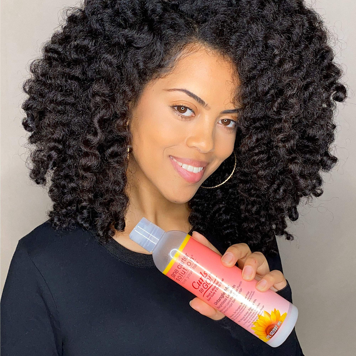Untangle Me frizz-control helps curls stay defined and calm.