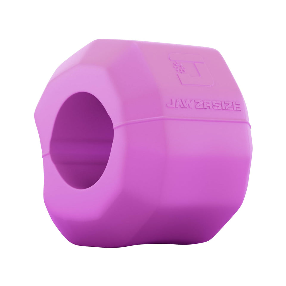 Jawzrsize jaw exerciser pink in hand for a sculpted jawline and toned facial muscles.