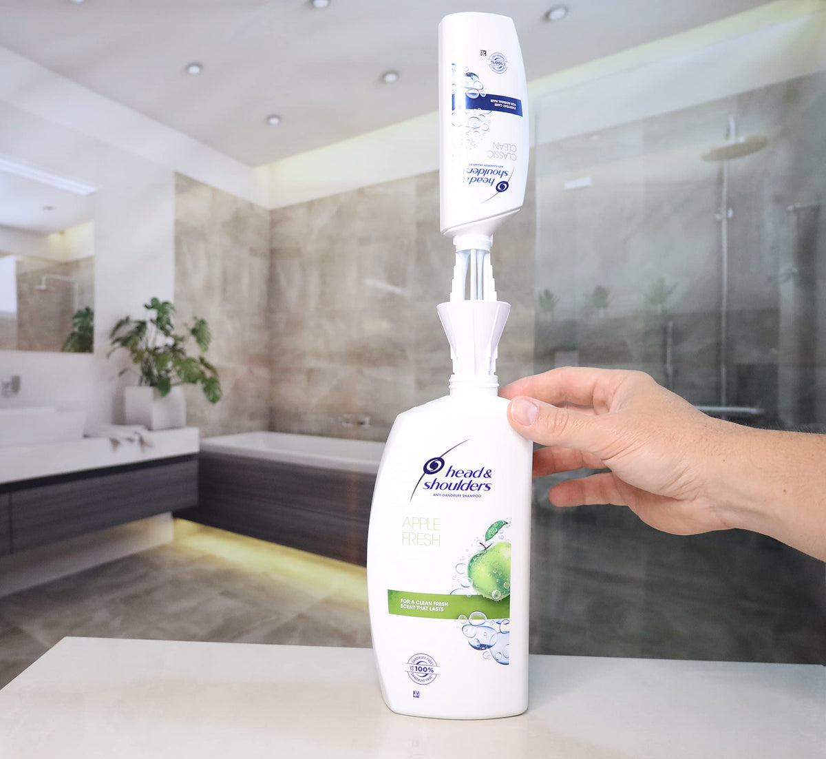 JCK Every Drop transfer-cap in action for quick mess-free bottle-to-bottle swaps
