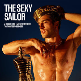 Jean Paul Gaultier Le Male Elixir travel spray tin packaging close-up for collector appeal.
