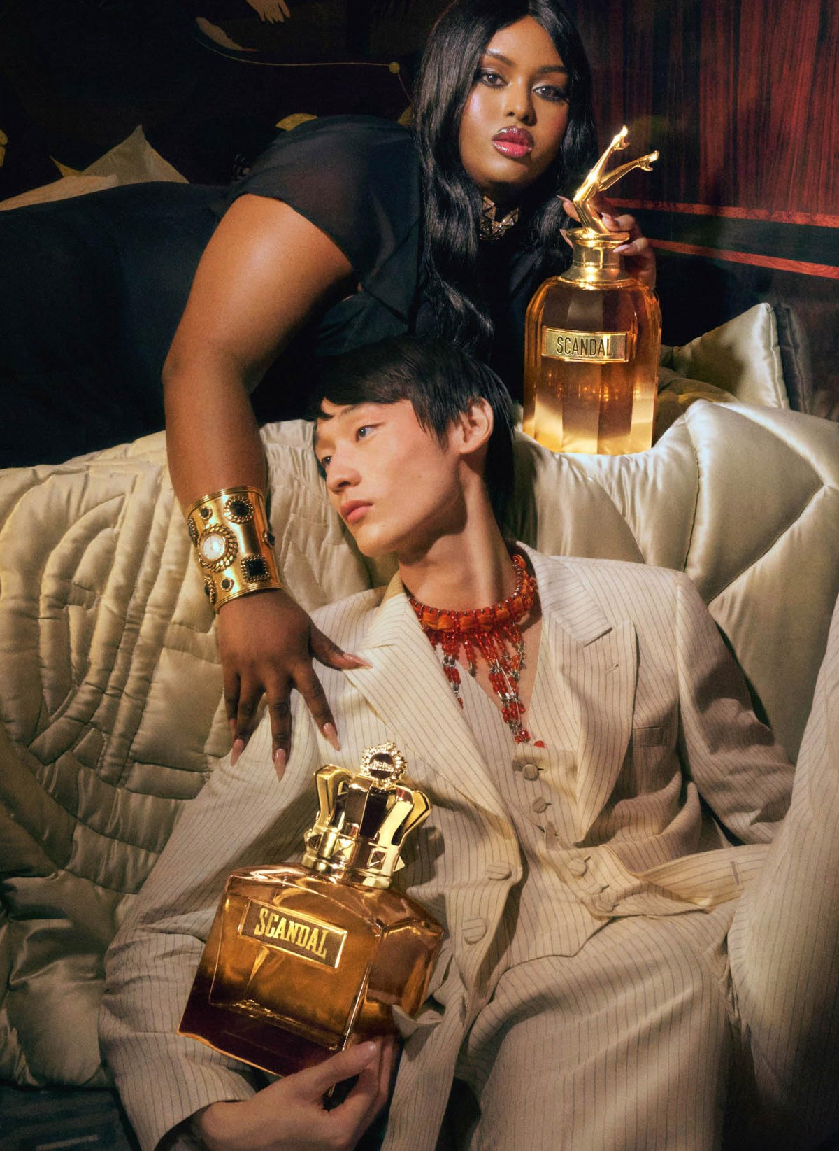 Jean Paul Gaultier Scandal Absolu Parfum spray captured mid-mist for impact
