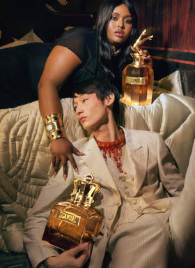 Jean Paul Gaultier Scandal Absolu Parfum spray captured mid-mist for impact