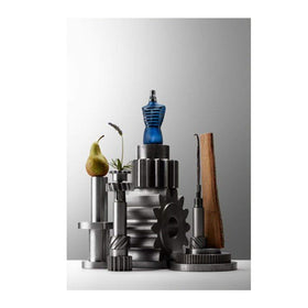 Fragrance-infused wood-texture bottle detail suggests warm, woody notes.