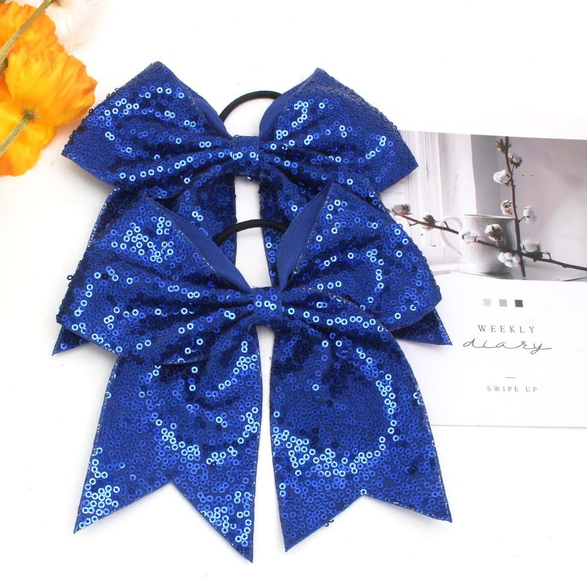Jeffan jumbo blue sequin bow worn in hair for performances