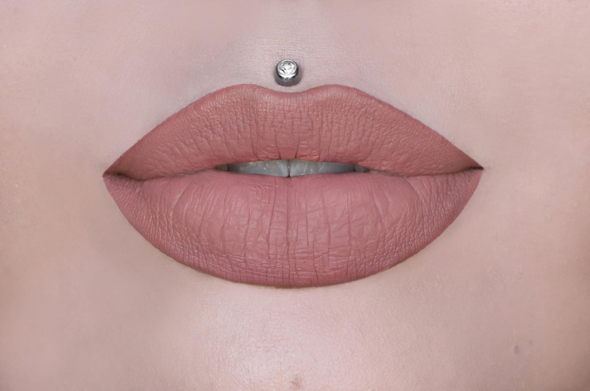 Swatches of Christmas Cookie reveal warm nude with gold pearl for all-day looks.