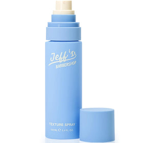 Jeff's Barbershop Sea Salt Texture Spray bottle demonstrates beachy texture with a matte finish.